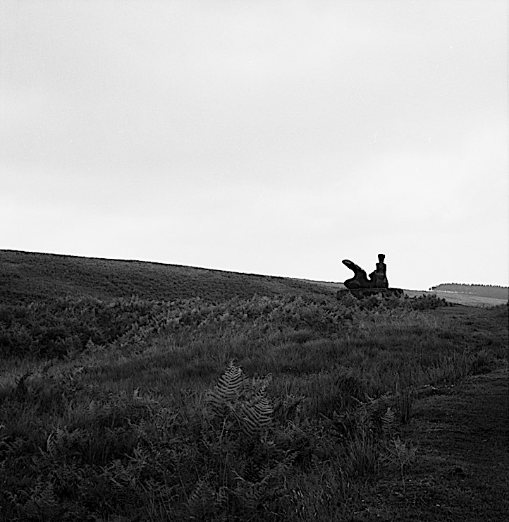 Black-and-white photograph of a Henry Moore sculpture, "Two-Piece Reclining Figure No. 1," in the Glenkiln Sculpture Park, Scotland