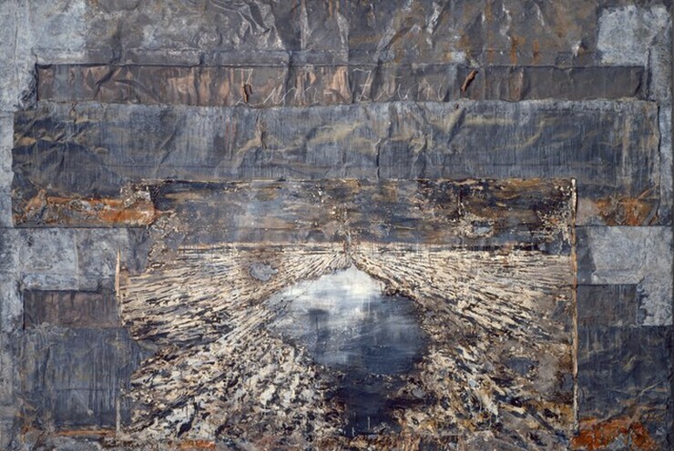 Horizontal bands of rumpled and wrinkled strips of lead are pieced together and overlap to create this horizontal, abstract work. The bands vary from smoke to charcoal gray, and there are some areas of burnt-orange rust. A smaller, ivory-white rectangle at the bottom center resembles a starburst created with textured, radiating bands of ivory and navy blue, surrounding a roughly teardrop-shaped hole that nearly spans the height of the smaller panel. The area within the teardrop is painted with smooth strokes of ice blue along the top, deepening to cobalt blue along the bottom. Tall letters in cursive white spelling out “Zim Zum” are written at the center of a band a quarter of the way down from the top edge of the composition.