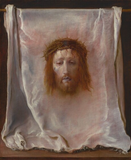 The head and pale face of a bearded man with a ring of interwoven branches of thorns over his chin-length, wavy, reddish-brown hair floats against a white cloth that has been hung over a wooden rod in this vertical painting. The cloth fills the composition. At its center, the man’s head faces us and he looks down with heavy-lidded, brown eyes. His lips are parted, and his cheeks are slightly sunken and shaded with pale lilac purple under high cheekbones. Blood drips down the man’s pallid forehead from the thorns. A brown spot high on his right cheek, on our left, might be a bruise or injury. A soft brown glow surrounds the head. The white cloth is frayed along its front edge, where it rests facing us on a wooden surface along the bottom edge of the painting. The cloth is bunched a little to each side where it drapes over the wooden rod above. The white cloth is painted with tones of pale coral pink, icy blue, silvery white, and dove gray. The background behind the cloth is black.